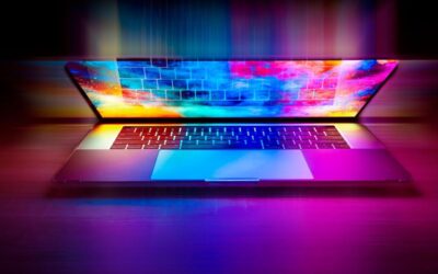 Un ordinateur portable ouvert avec écran arc-en-ciel et clavier rétroéclairé